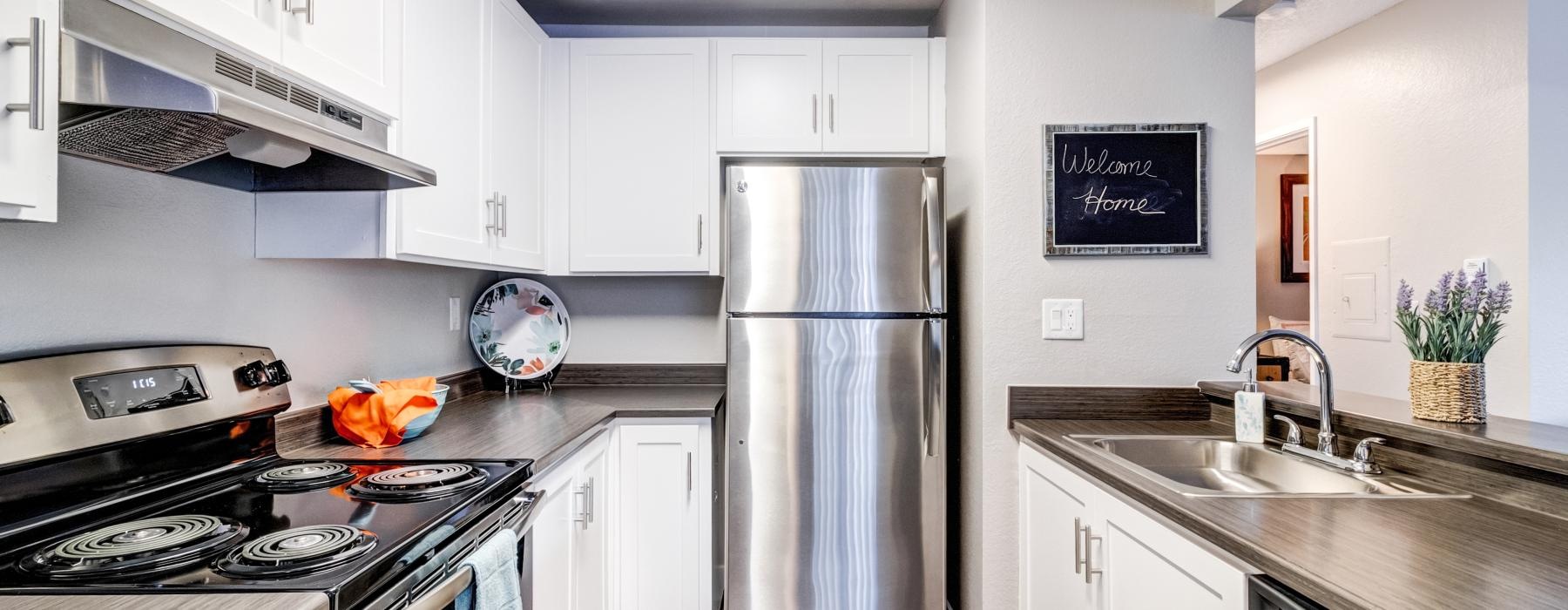 a kitchen with white cabinets