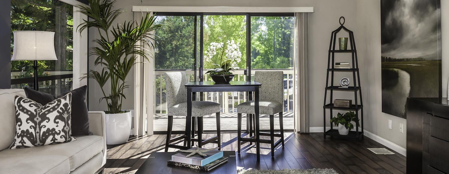 a living room with a table and chairs