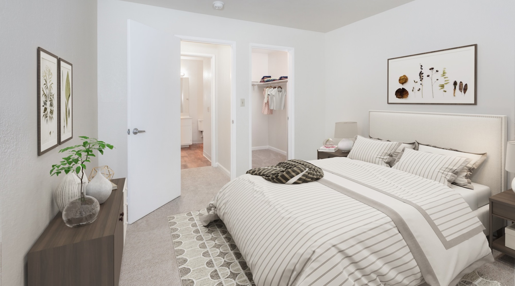 bedroom with lamps dressers and a closet