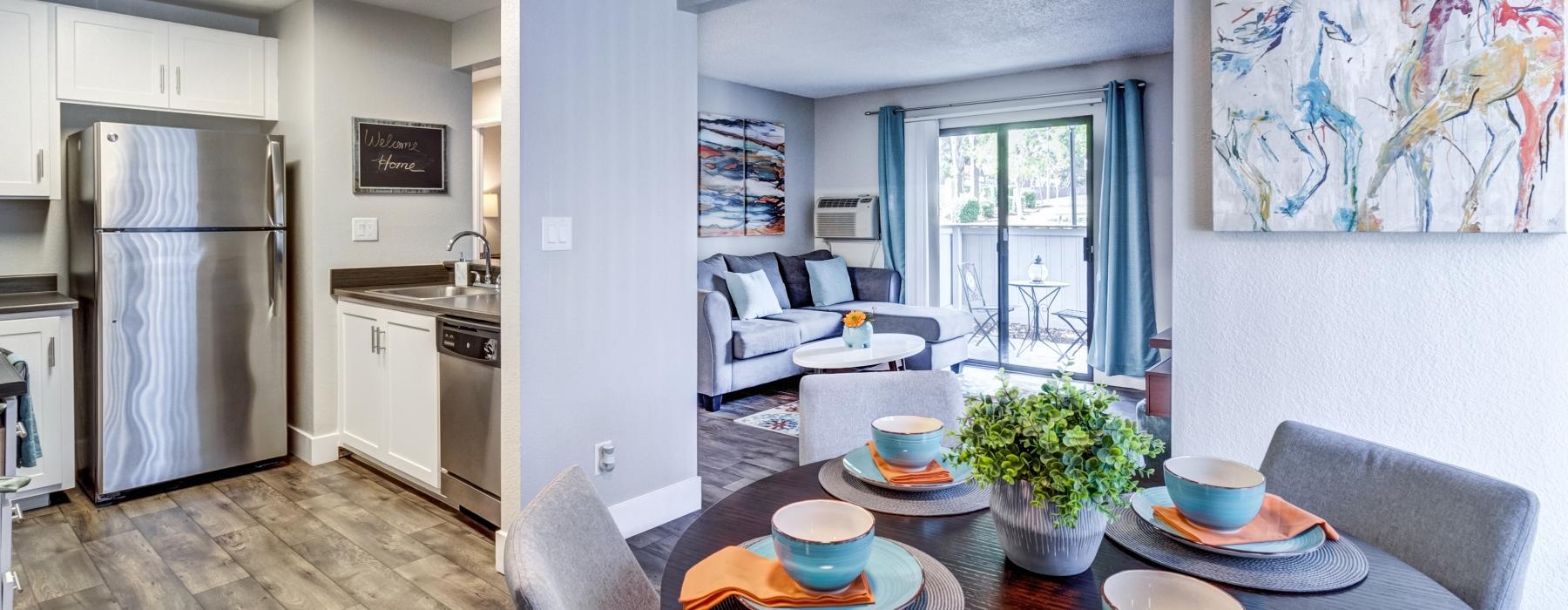 a kitchen with a table and chairs