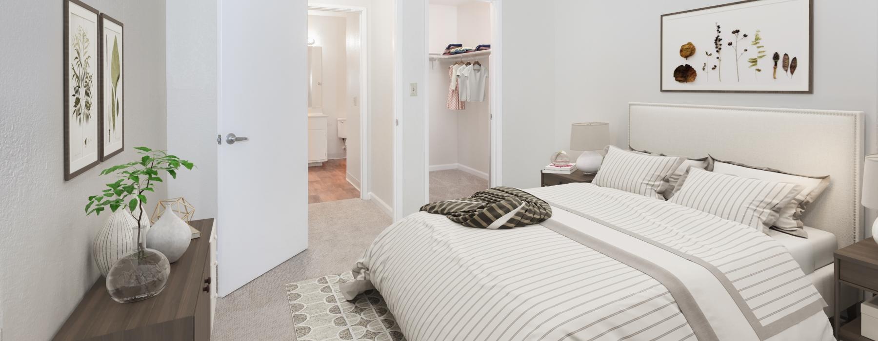a bedroom with a bed and a plant